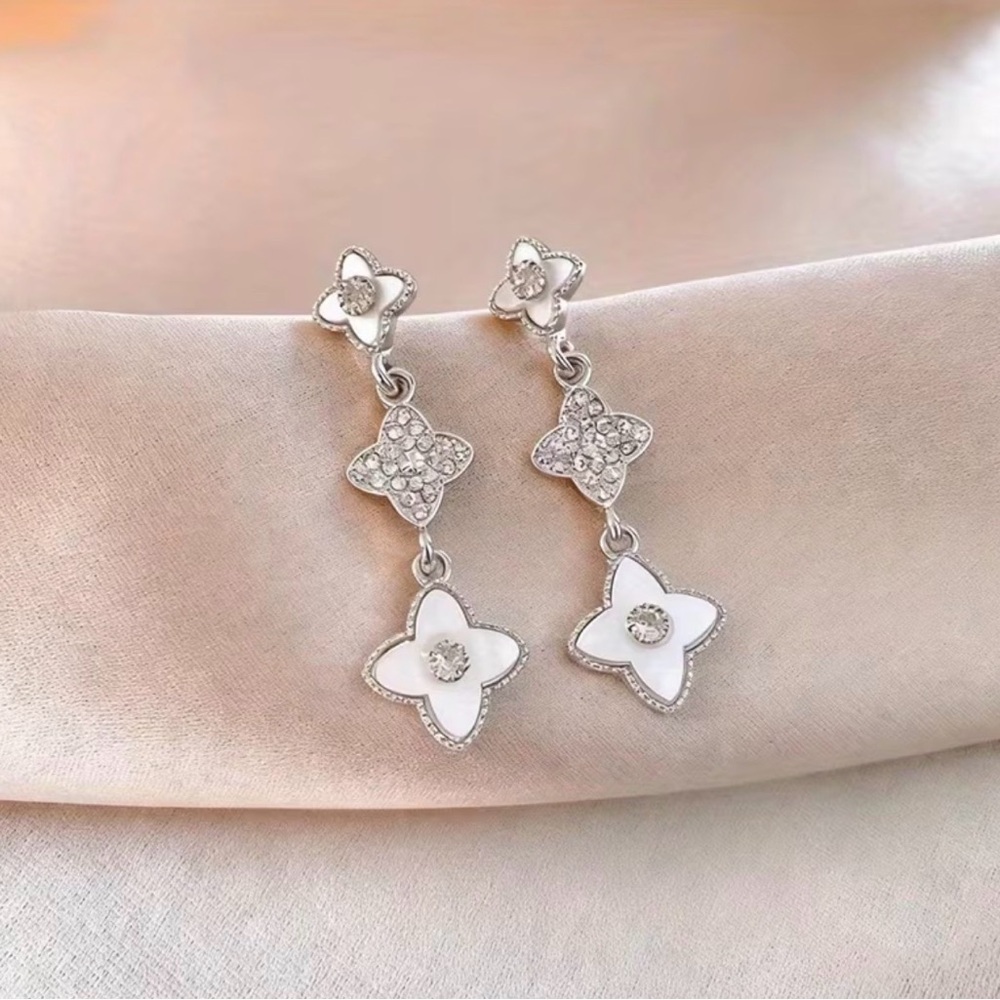 silver drop earrings mother-of-pearl four-leaf clover motifs shimmering stones